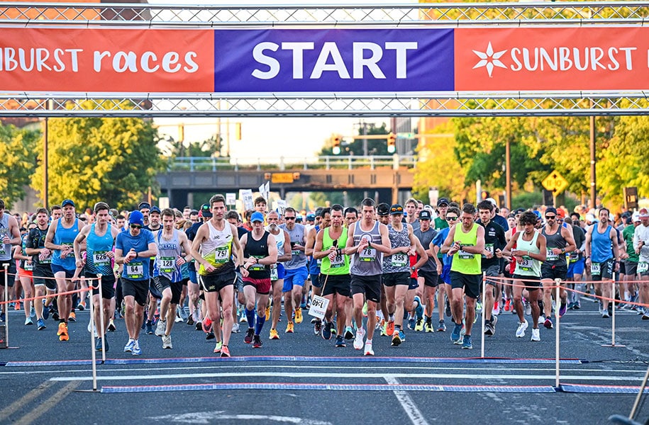 Sunburst Race start line with runners